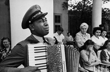 A man crying while playing an instrument 