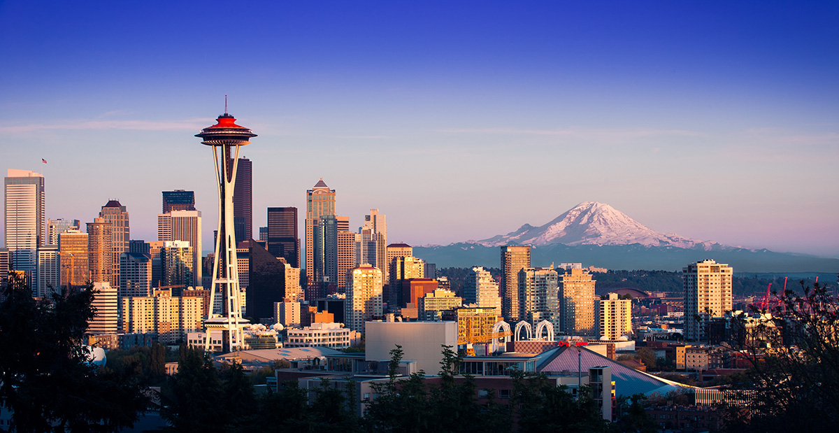 View of the Seattle Skyline at night, photo by Thom Milkovic via Unsplash