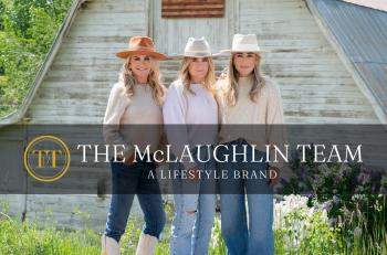 Mother and two daughters in front of barn